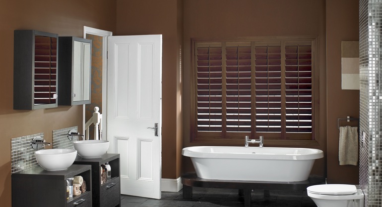 Stained wood shutter in Hartford bathroom